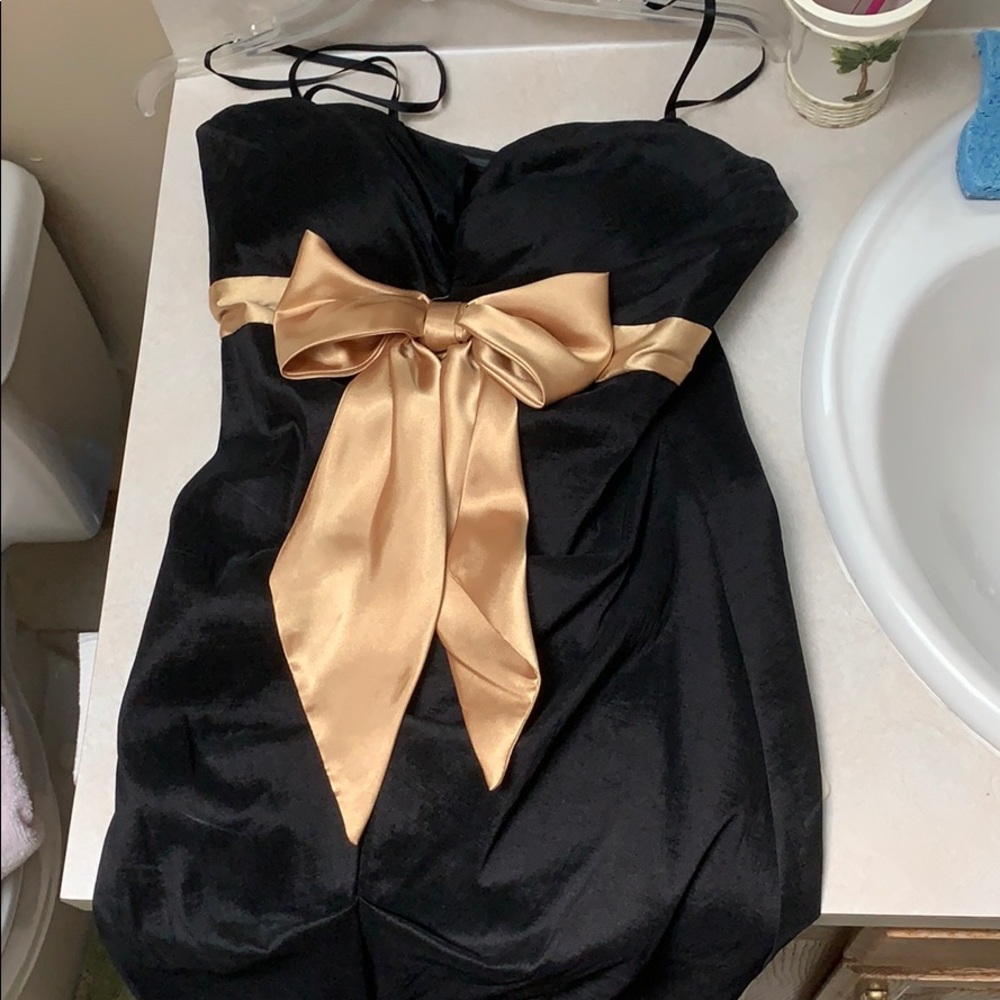 Black dress with gold bow